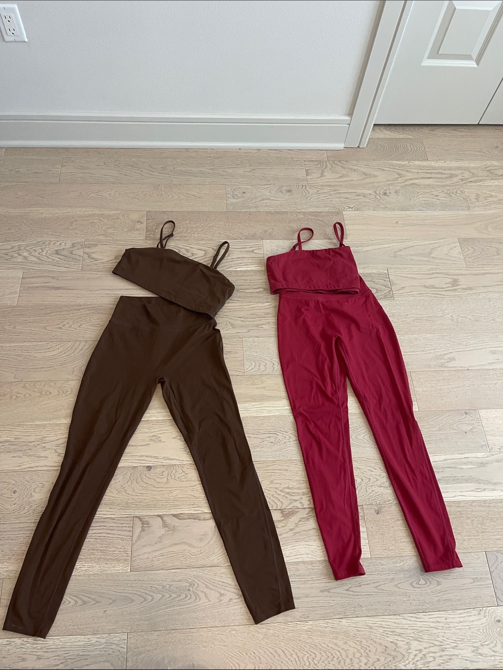 Women’s workout sets. Matching tights and sports bras in brown and red.